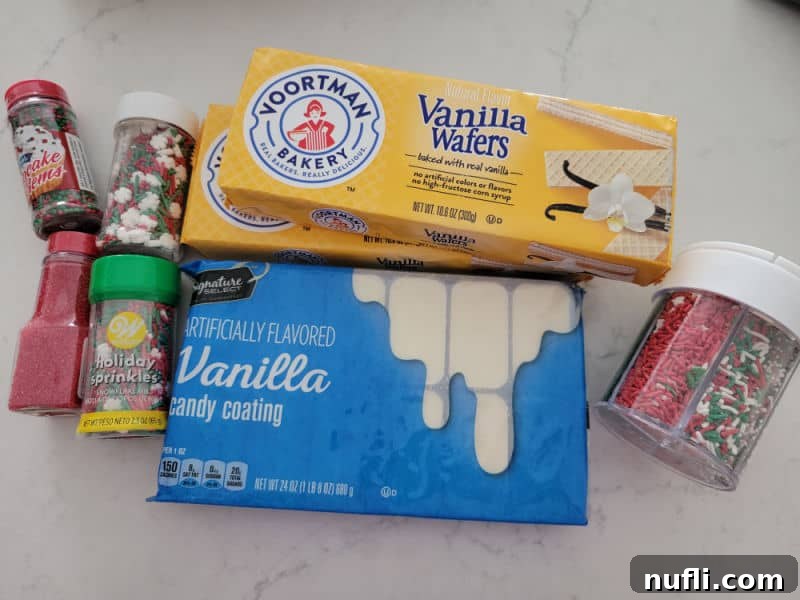 Ingredients for White Chocolate Dipped Sugar Wafers: holiday sprinkles, vanilla wafers, white candy coating