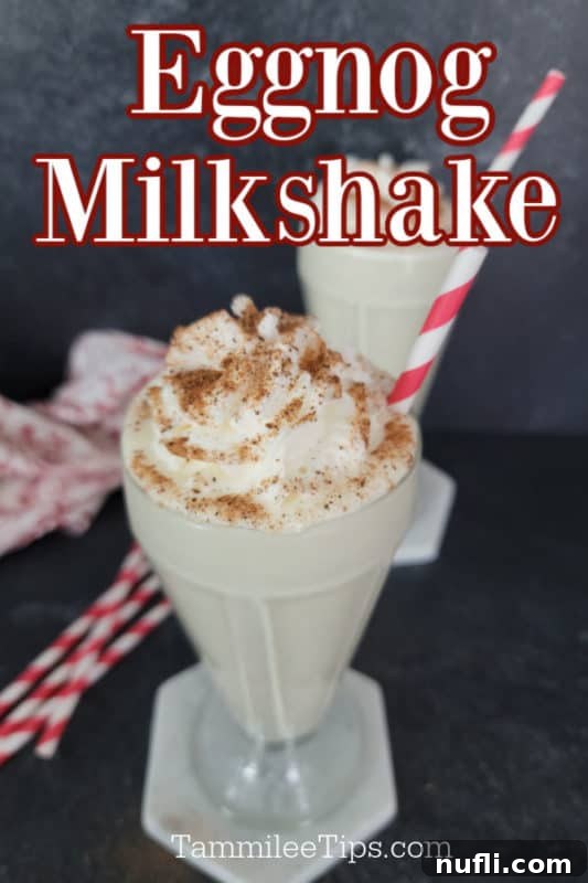 A festive Eggnog Milkshake in an old-fashioned glass, garnished with luscious whipped cream and a dusting of ground nutmeg, complete with a charming red striped straw. The text 'Eggnog Milkshake' is artfully overlaid on the image.