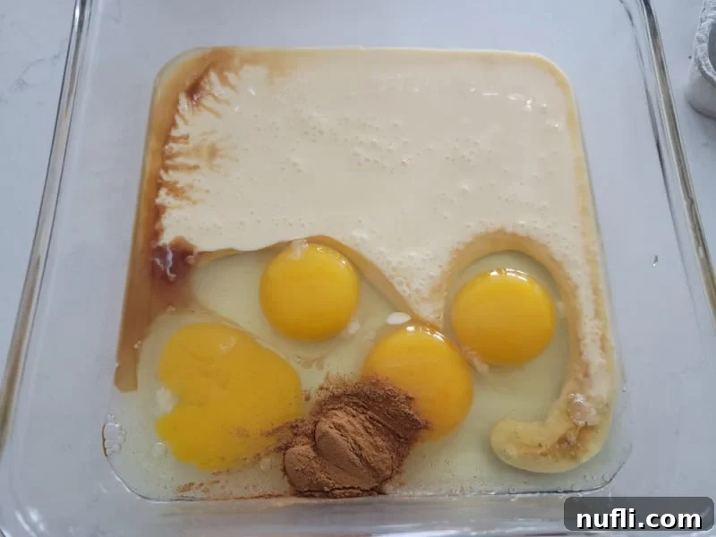 Effortless Eggnog French Toast 4 Eggnog French Toast ingredients in a glass pan