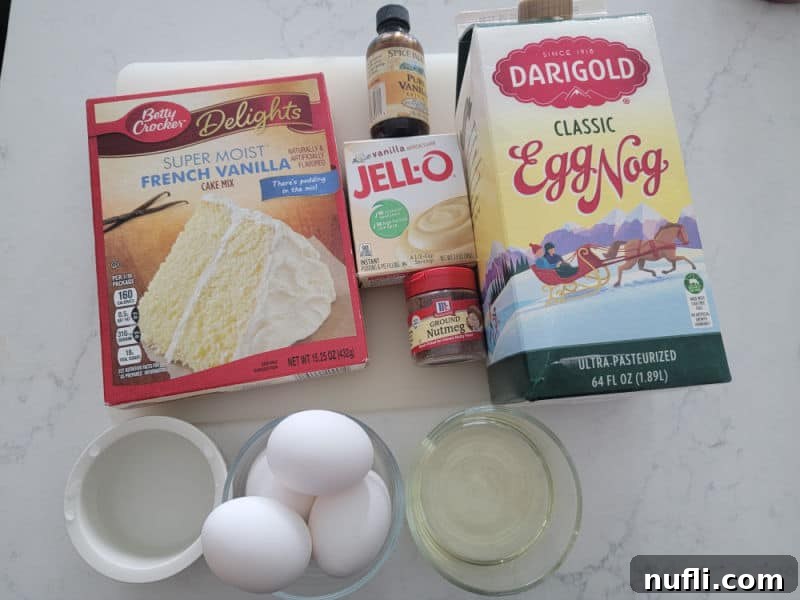 Eggnog Cake Ingredients, French vanilla cake mix, vanilla jello pudding, vanilla extract, eggnog, eggs, and ground nutmeg 