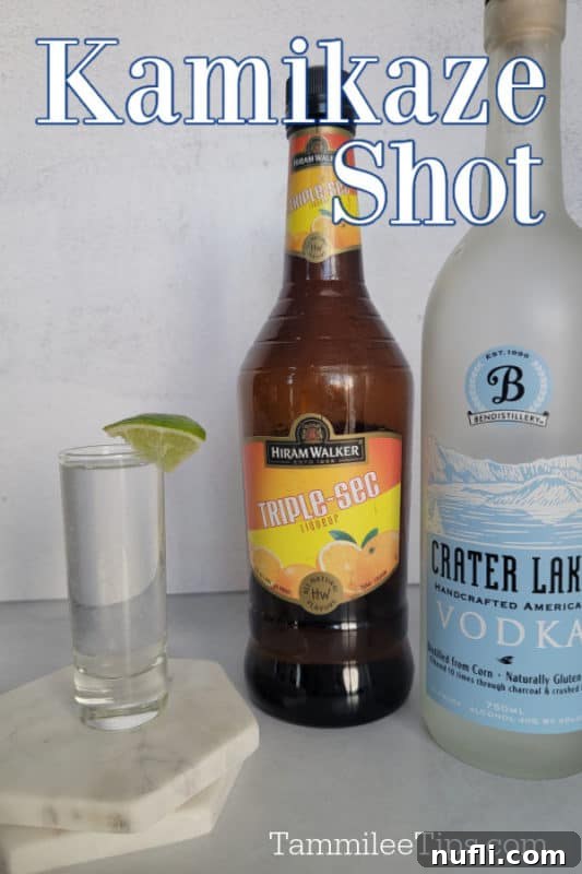 Kamikaze Shot text over a bottle of vodka, triple sec and a glass shot glass with a lime wedge