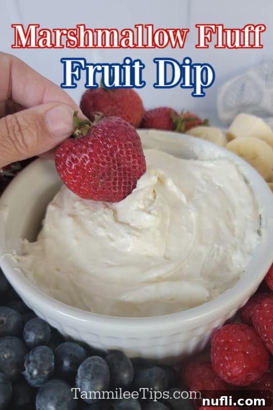 Marshmallow fluff fruit dip text written over a hand holding a strawberry dipping into Marshmallow Fruit dip surrounded by fresh fruit. 