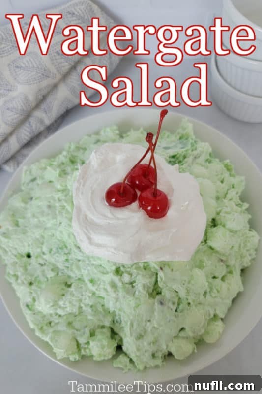 Watergate Salad printed in text over a large bowl with Watergate green salad topped with a dollop of Cool Whip and maraschino cherries