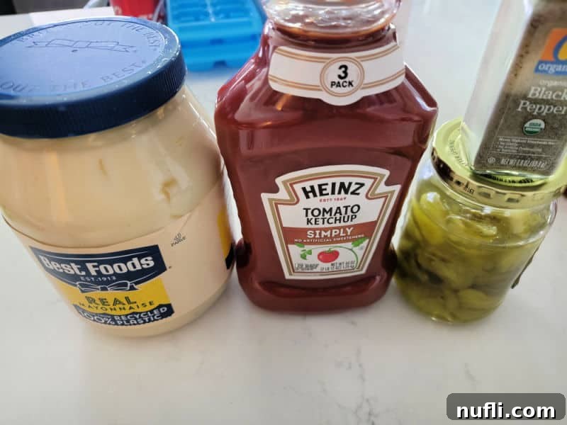 Ingredients for Fry Sauce displayed: mayonnaise, ketchup, pickle juice, and black pepper