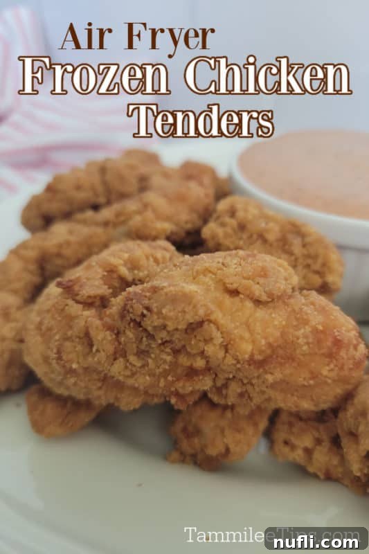 Air Fryer frozen chicken tenders text over chicken on a white plate next to a bowl of sauce