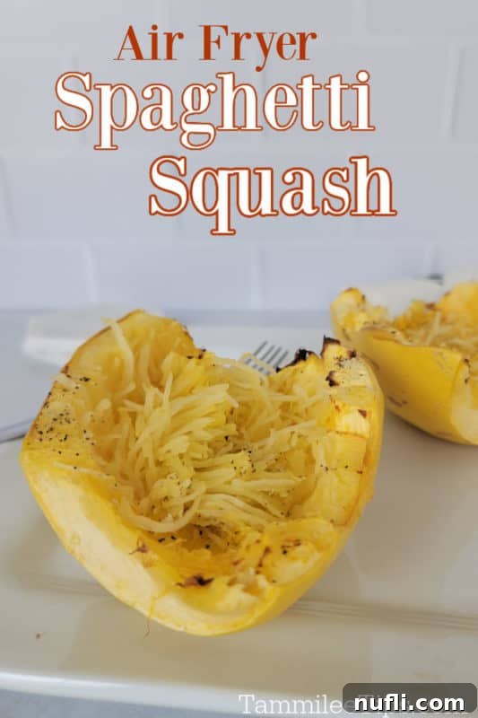 Air fryer spaghetti squash over air fried spaghetti squash on a white plate