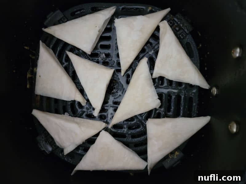Crispy Air Fried Frozen Spanakopita 4 Frozen spanakopita in the air fryer basket