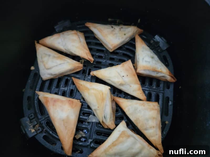 Crispy Air Fried Frozen Spanakopita 5 Air fried spanakopita in the air fryer basket