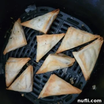 air fried spanakopita in the air fryer basket