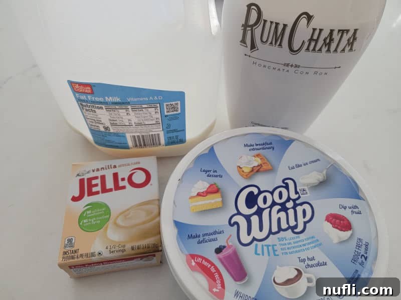Ingredients for RumChata Pudding Shots: cold milk, RumChata, vanilla instant pudding mix, and Cool Whip