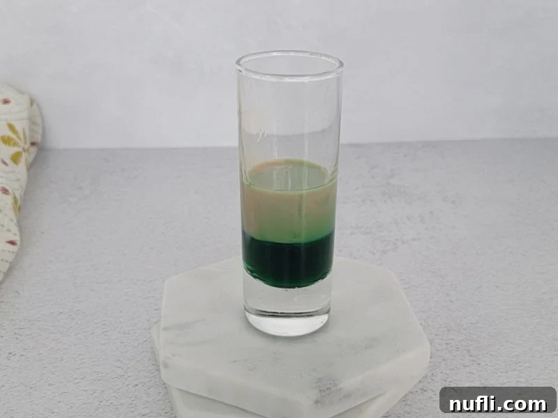 layered shot on two white coasters. 