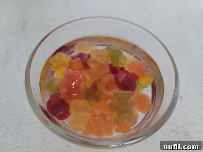 Tipsy Teddies 6 Gummy bears floating in clear liquid in a glass bowl