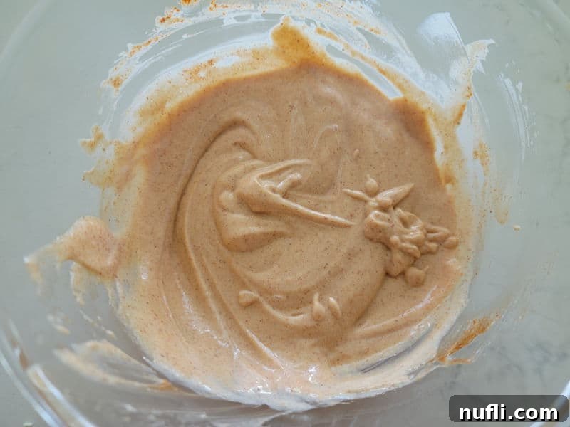 Effortless Homemade Yum Yum Sauce 5 Yum Yum Sauce after whisking in a clear glass bowl