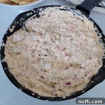 Rotel Sausage Dip in a cast iron skillet