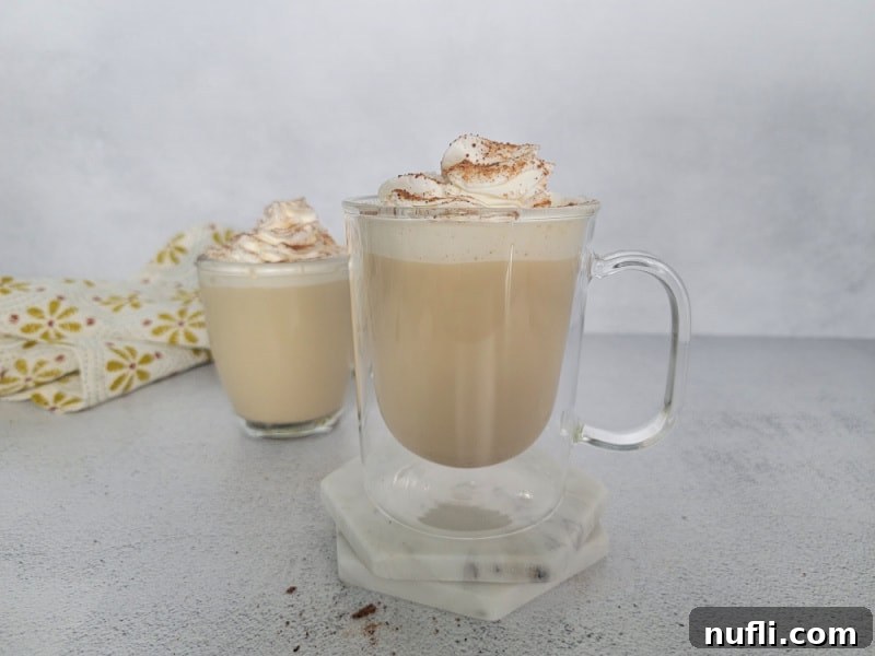 2 Eggnog Coffees in clear glass coffee mugs with a cloth napkin