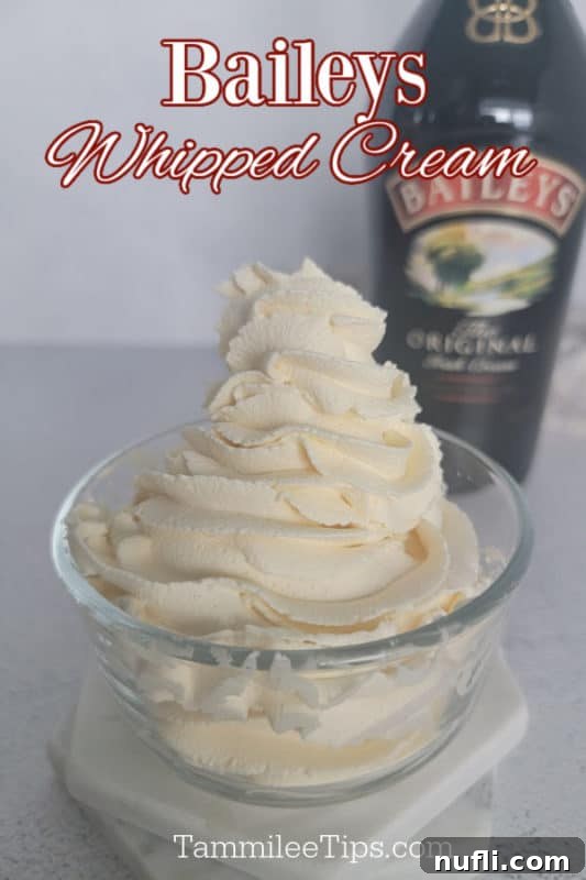 Baileys Whipped cream text over a glass jar with whipped cream swirled in it near a bottle of Baileys Irish Cream. 
