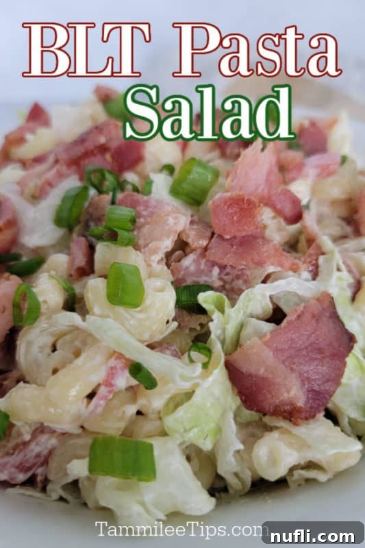 BLT Pasta Salad over bacon, macaroni, and green onions in a white bowl 