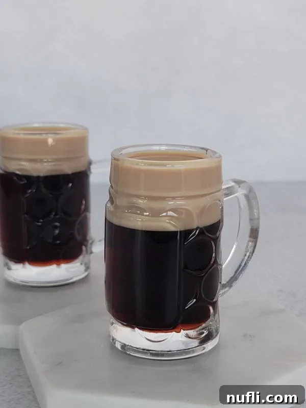 2 Baby Guinness Cocktails in mini beer glasses
