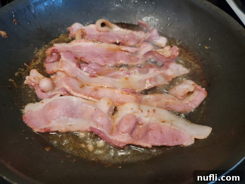 Bacon cooking in a skillet
