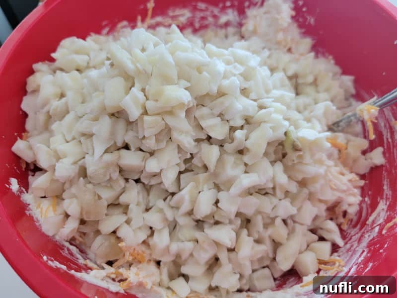 Diced potatoes in a red bowl 