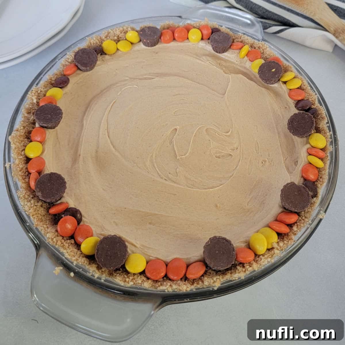 No bake peanut butter pie rimmed in reeses pieces