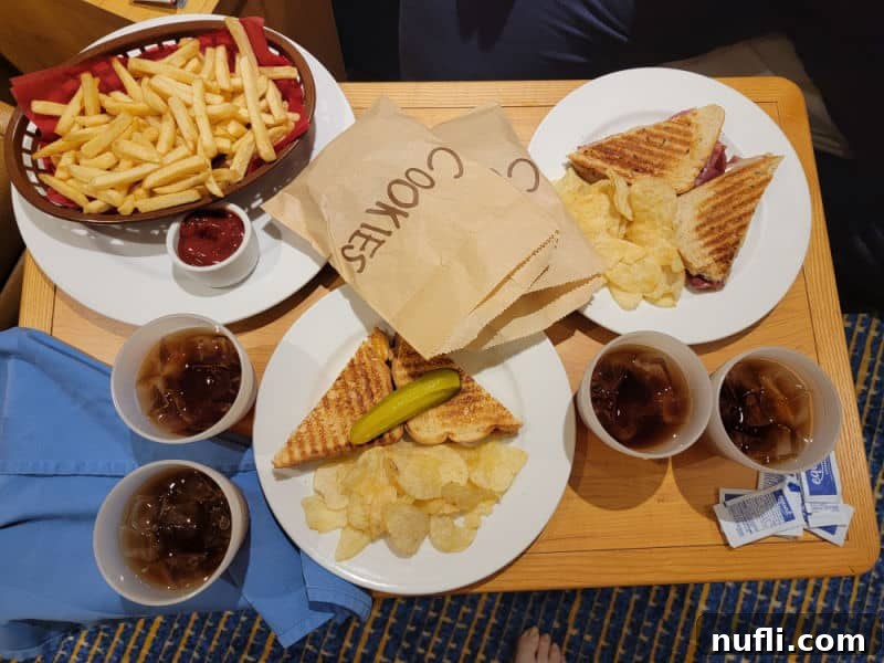 Carnival Radiance 4-Day Baja Mexico Escape 13 wooden tray with sandwiches, and bags of cookies next to iced tea
