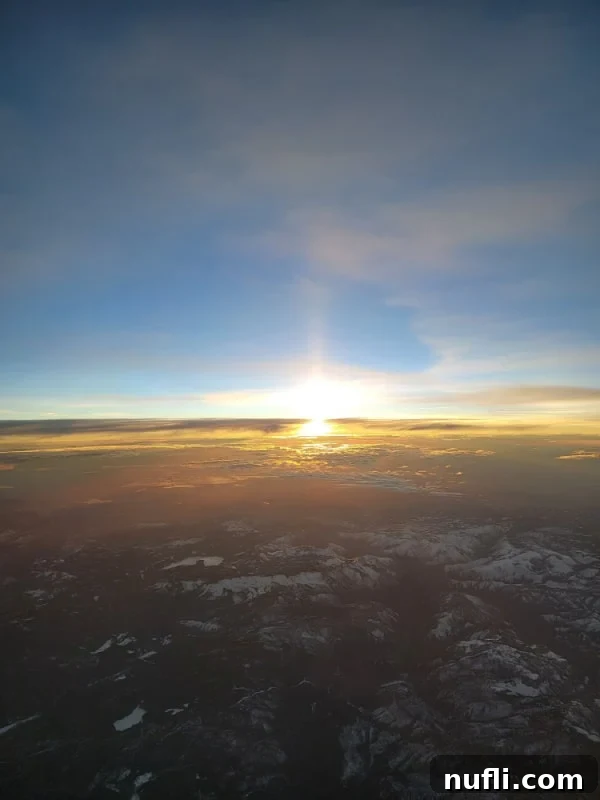 Carnival Radiance 4-Day Baja Mexico Escape 3 Sunrise from a plane over snowy mountains