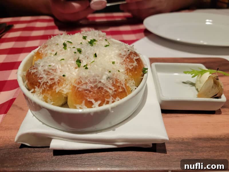 Carnival Radiance 4-Day Baja Mexico Escape 7 Bread in a white bowl covered in parmesan cheese