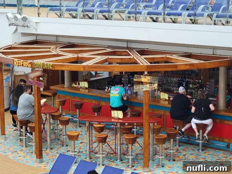 Red Frog Rum Bar with people sitting on stools at the bar