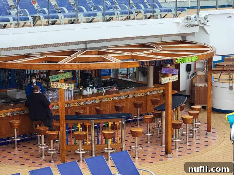 Blue Iguana Tequila Bar with people sitting on stools near the bar