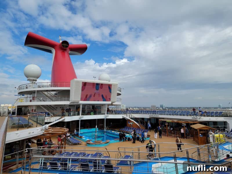 Carnival funnel over the pool deck with large movie screen