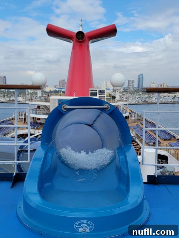 Waterslide entrance with Carnival cruise funnel in the background