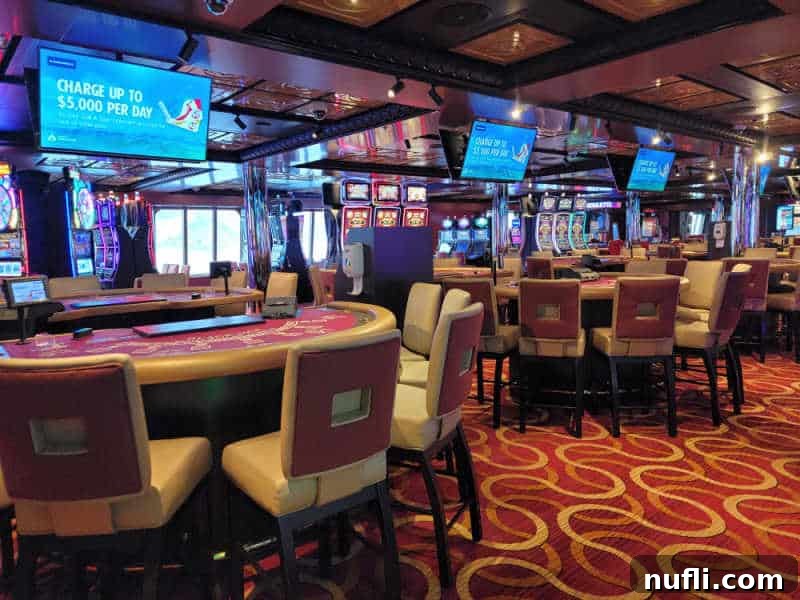 Casino tables and chairs with TVs above them