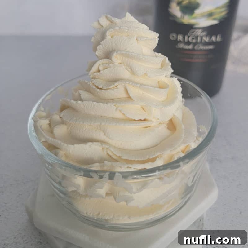 Bailey's Whipped Cream swirled in a glass bowl.