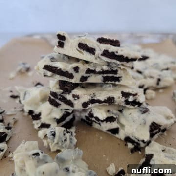 Effortless Two-Ingredient Oreo Bark 9 2-Ingredient Oreo Bark stacked on parchment paper