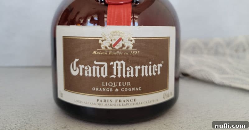 Close up of classic Grand Marnier Liqueur bottle with red ribbon