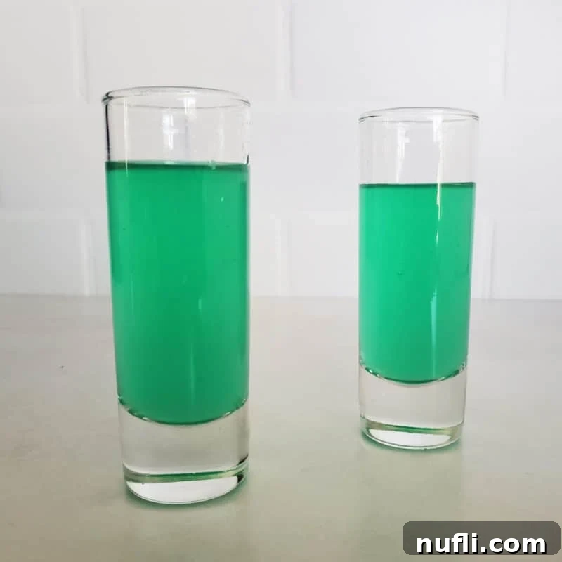 Malibu Rum Tropical Creations 13 Two green cocktail shots in tall shot glasses