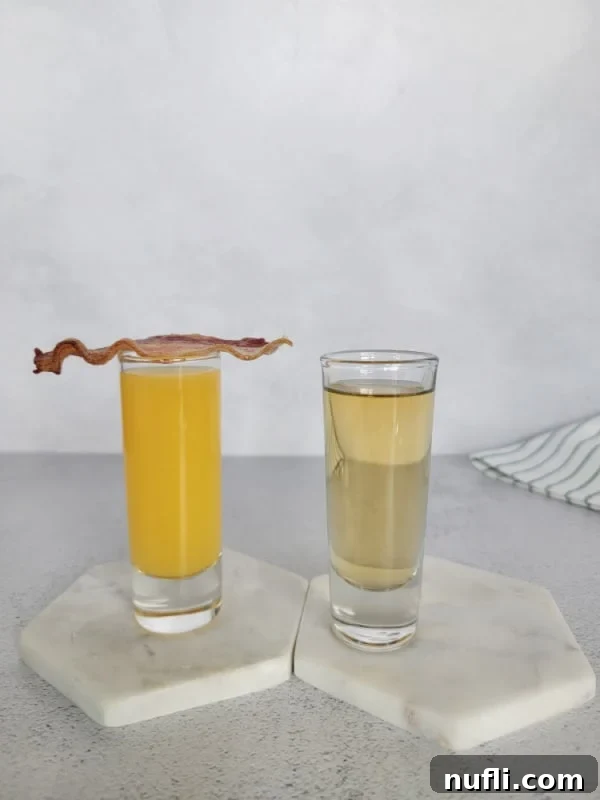 Irish Breakfast Shot in two shot glasses, one with bacon on top of it
