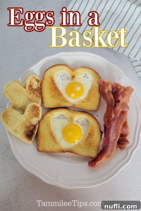 Eggs in a basket over a white plate with two pieces of eggs in a basket toast and bacon