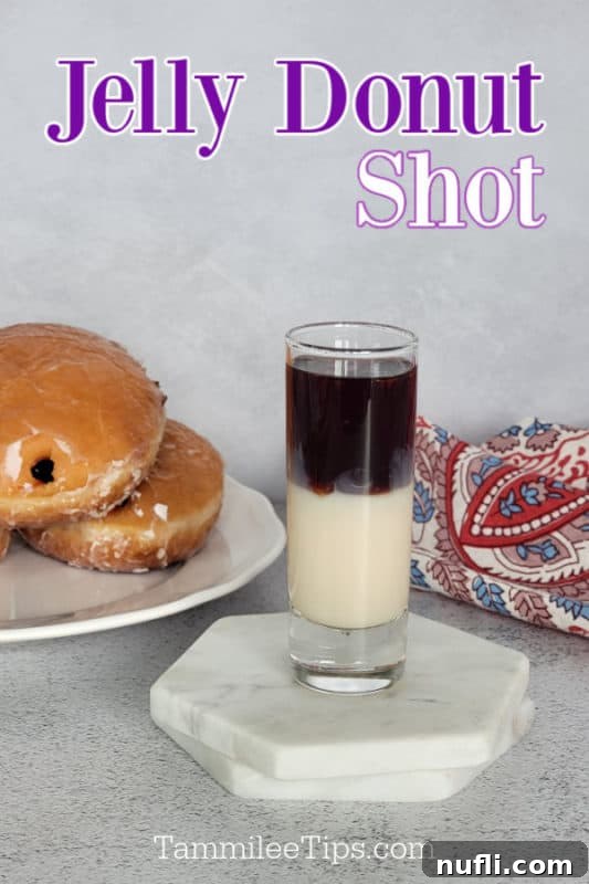 Jelly Donut Shot text over a layered shot on a white coaster next to a plate of jelly doughnuts and a cloth napkin, highlighting the drink's appeal for brunch or parties.