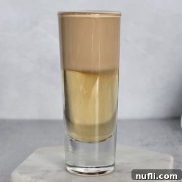 Nutty Irishmen Layered cocktail on a marble coaster