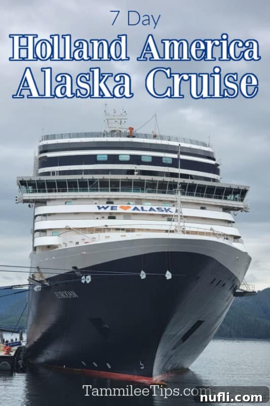 A majestic cruise ship with 'We Heart Alaska' banner sailing through Alaskan waters, symbolizing an unforgettable 7-day Holland America Alaska Cruise experience.