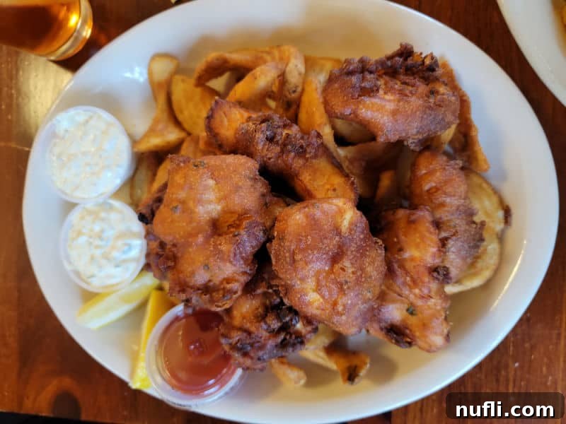 Fish and chips on a white plate 