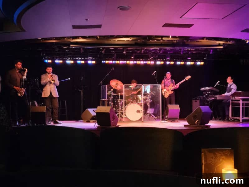 A dynamic blues band performing live on stage, creating an electrifying atmosphere at the BB King Blues Club aboard the Eurodam.