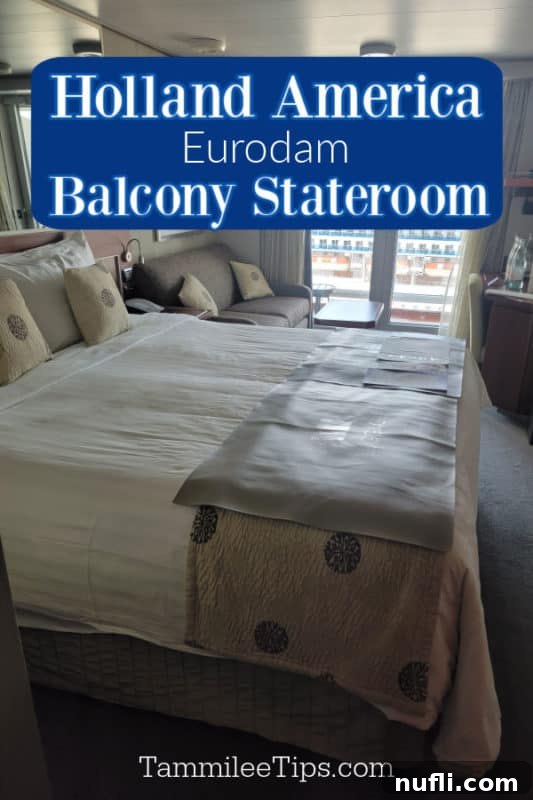 Holland America Eurodam Balcony Stateroom over a large bed, couch, looking out to another cruise ship