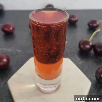 Red shot surrounded by cherries