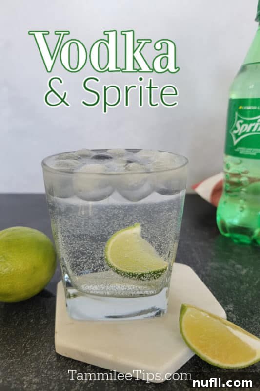 Vodka and Sprite over a cocktail glass with lime wedge garnish on a coaster next to a bottle of sprite and limes