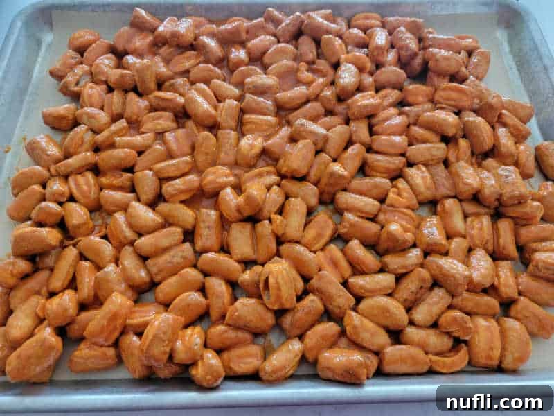 buffalo pretzels spread out on a baking sheet