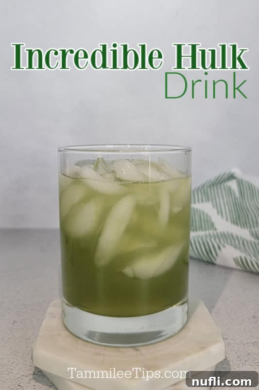 Gamma Ray Gulp 2 Incredible Hulk Drink over a green cocktail in a glass on a white coaster and a green cloth napkin