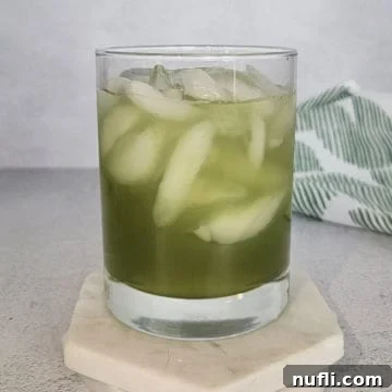 Gamma Ray Gulp 8 Incredible Hulk Drink in a cocktail glass on a white coaster